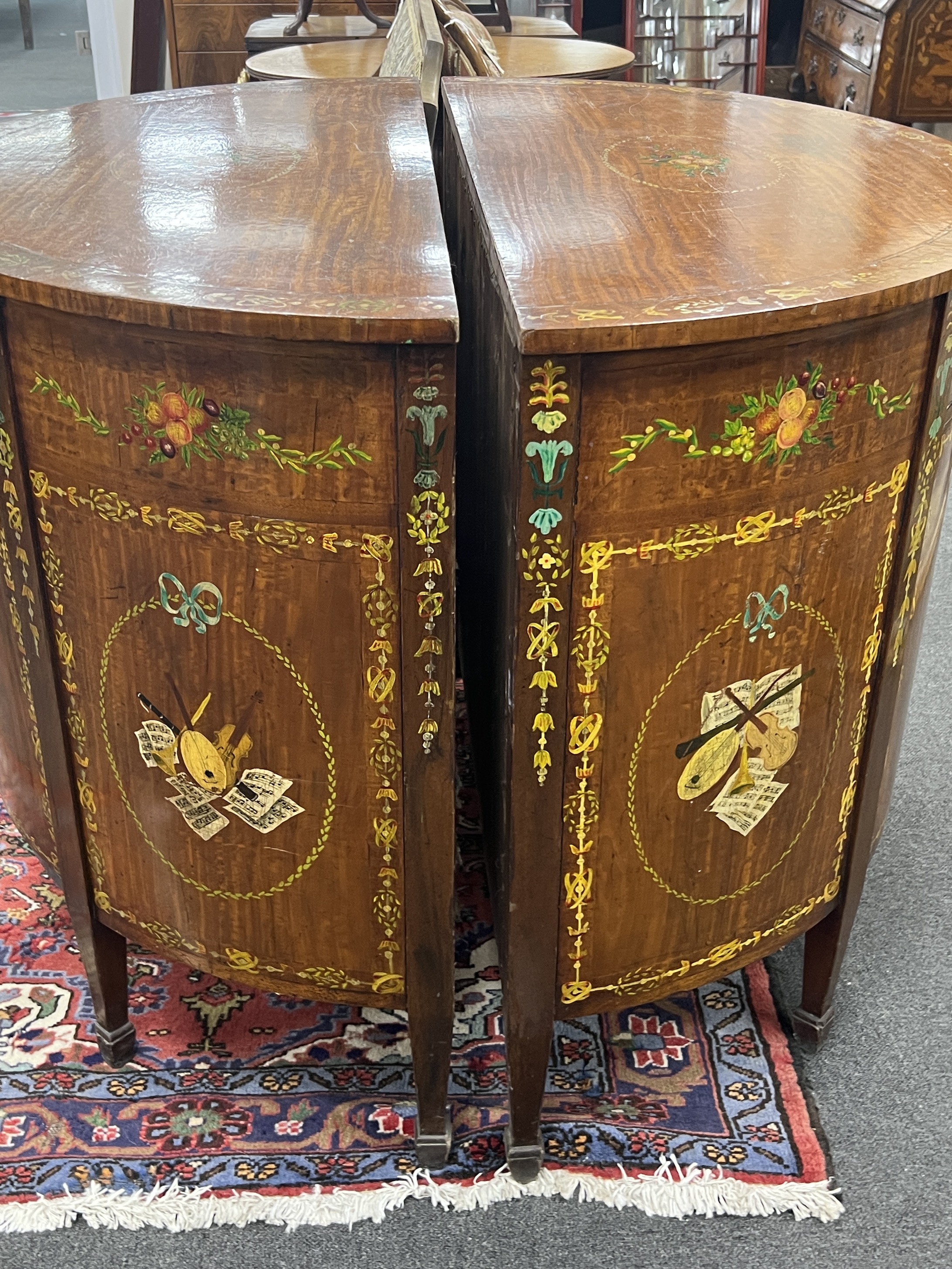 A pair of Sheraton revival painted D shaped commodes, width 107cm, depth 54cm, height 92cm